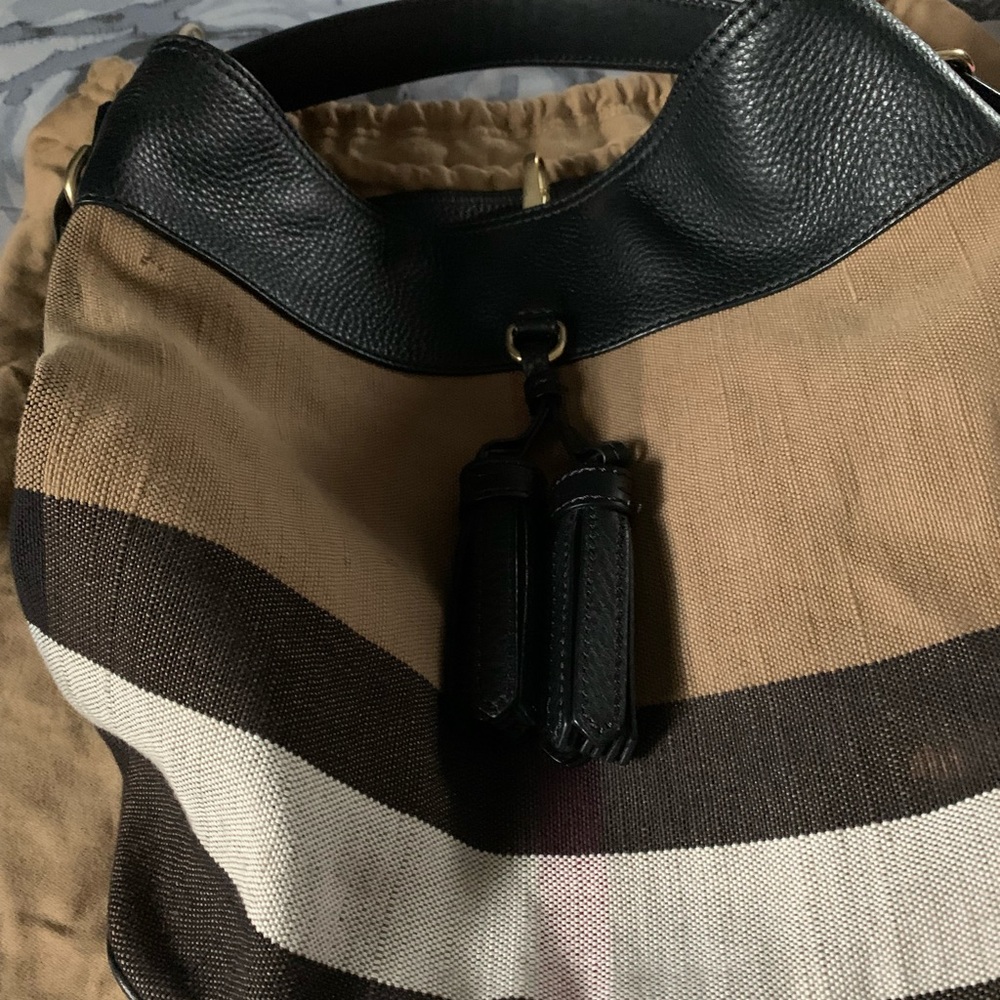 Authentic Burberry, Have a little White spot on the side of the purse.
